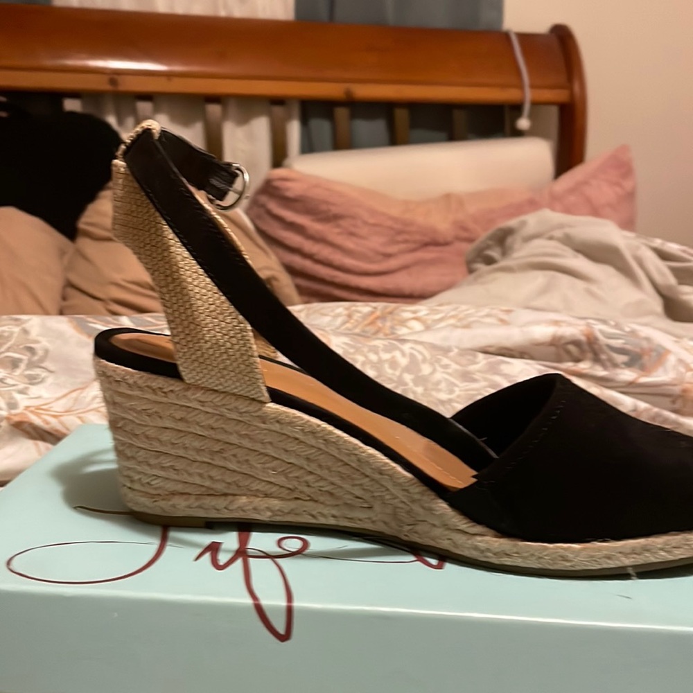 Woman’s black espadrilles